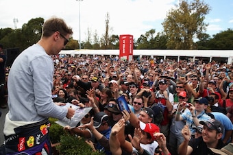 Sebastian Vettel signs autographs before the 2013 Australian Grand Prix. Sebastian Vettel signs autographs before the 2013 Australian Grand Prix.