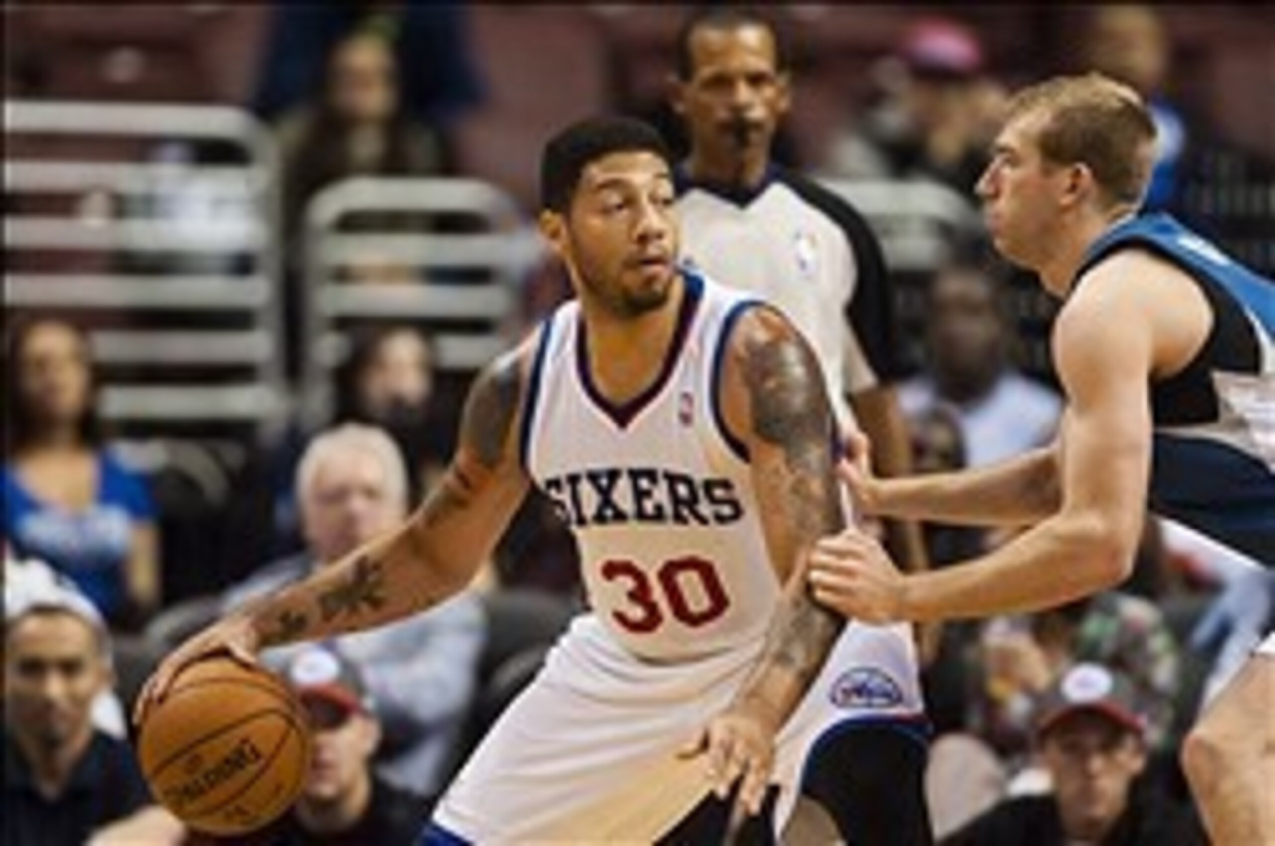 Oct 23, 2013; Philadelphia, PA, USA; Philadelphia 76ers forward Royce White (30) is defended by Minnesota Timberwolves forward Robbie Hummel (6) during the fourth quarter at Wells Fargo Center. The Timberwolves defeated the Sixers 125-102. Mandatory Credi