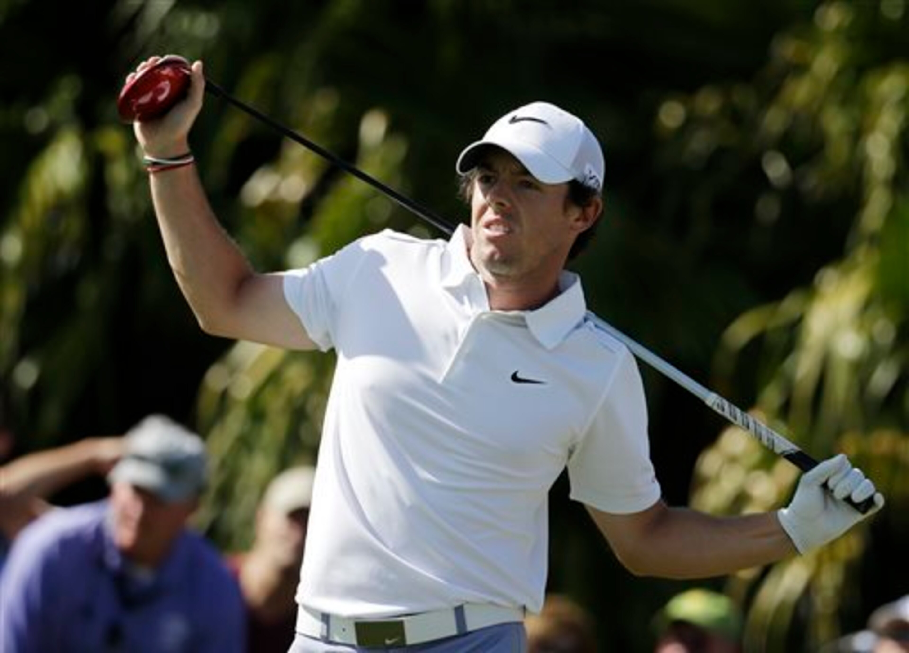 Rory McIlroy checks out a wayward drive, but he has things pointed in the right direction again.