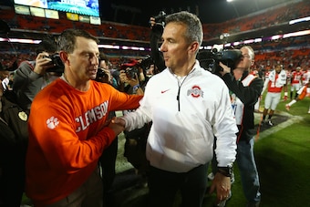 Where do Clemson's Dabo Swinney (left) and Urban Meyer of Ohio State fall on our list of the 25 best coaches in college football?