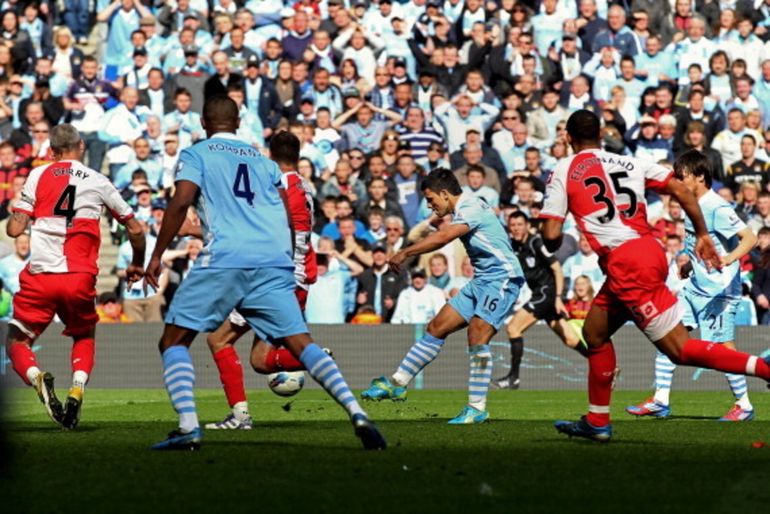 MANCHESTER, ENGLAND - MAY 13:  Sergio Aguero of Manchester City scores his team's third and matchwinning goal during the Barclays Premier League match between Manchester City and Queens Park Rangers at the Etihad Stadium on May 13, 2012 in Manchester, Eng