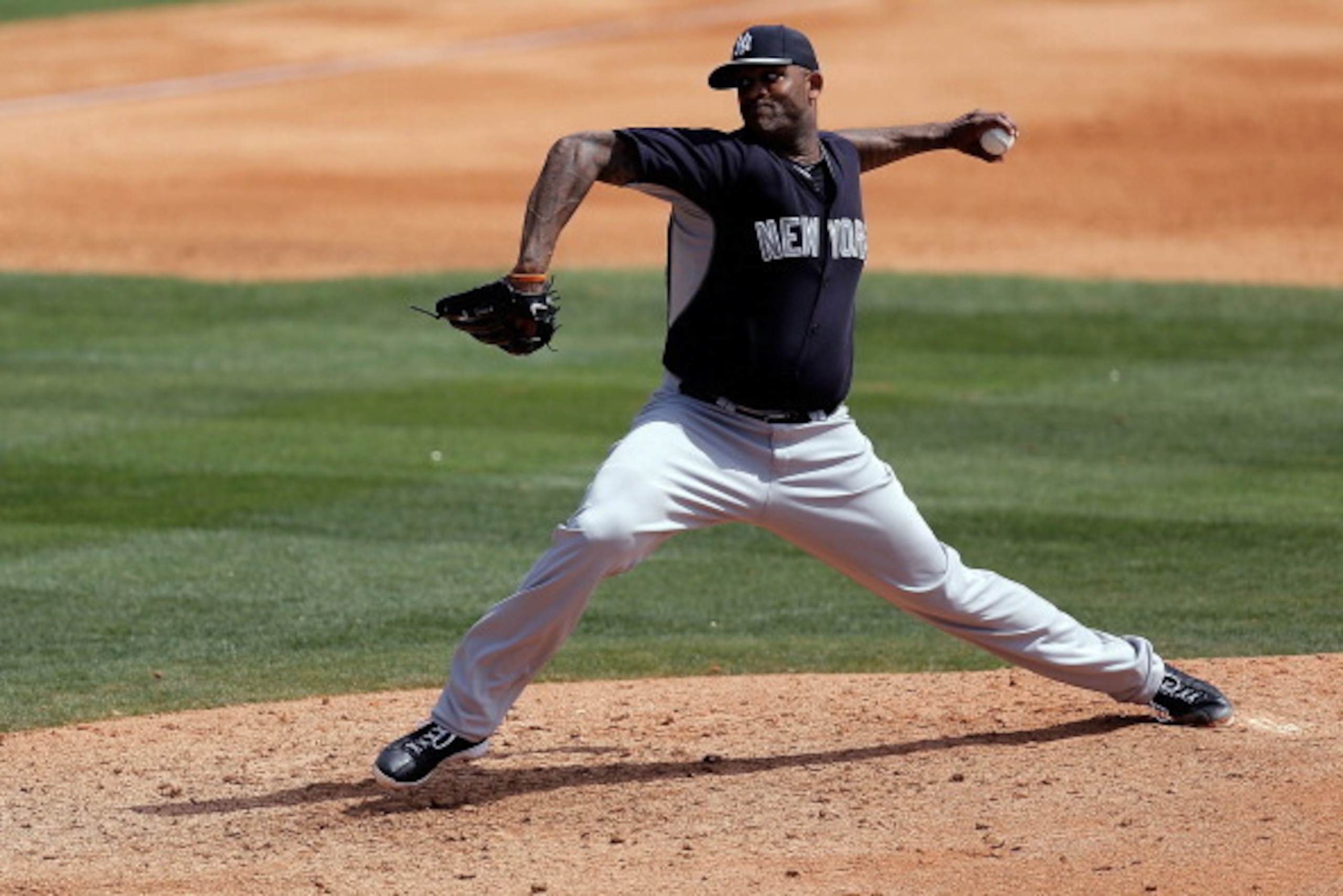 VIERA, FL - MARCH 11:  CC Sabathia #52 of the New York Yankees throws a pitch in the third inning of a game against the Washington Nationals at the Space Coast Stadium on March 11, 2014 in Viera, Florida.  (Photo by Stacy Revere/Getty Images)