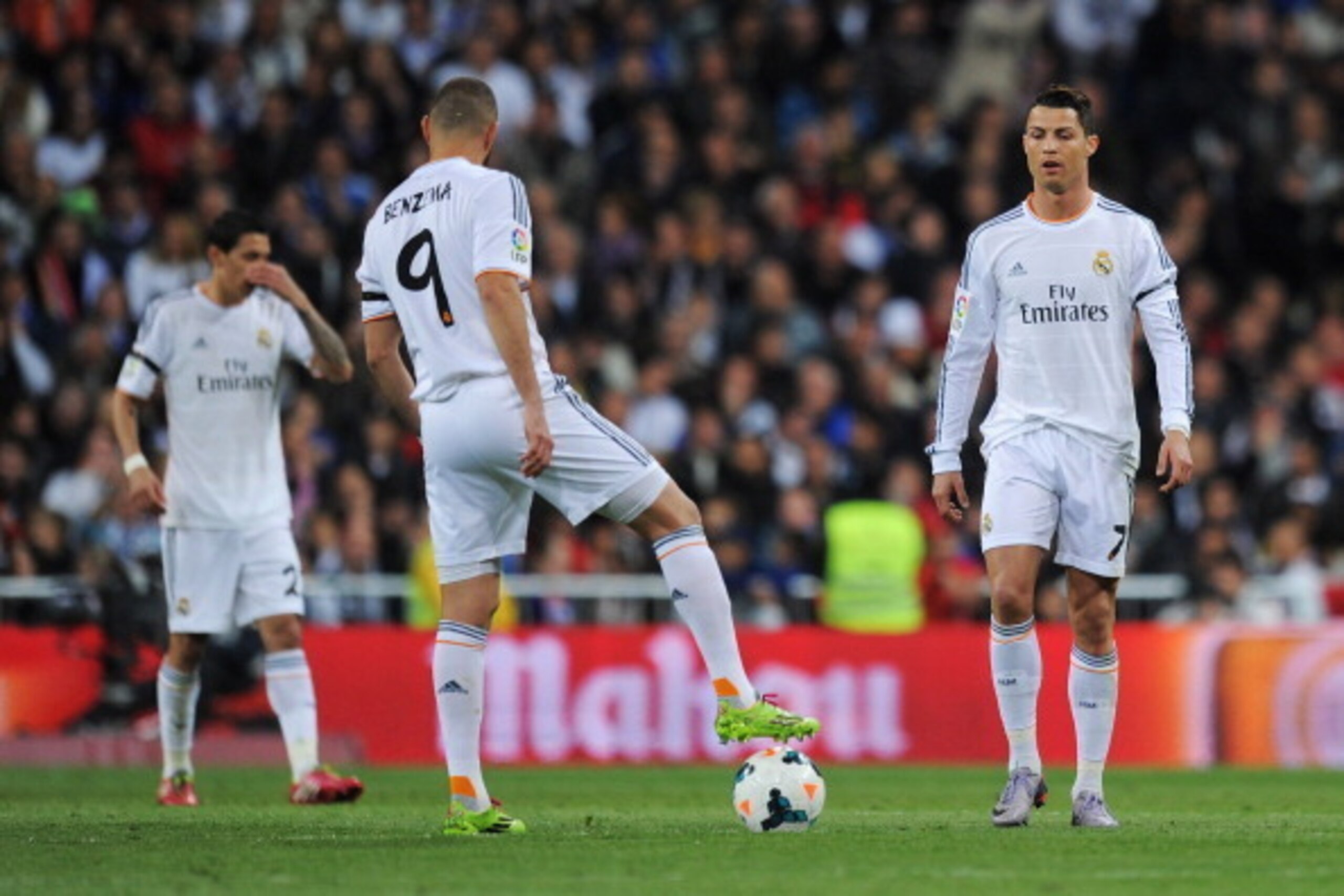 MADRID, SPAIN - MARCH 23: Cristiano Ronaldo (R) of Real Madrid looks dejected after a goal by Andres Iniesta of Barcelona during the La Liga match between Real Madrid CF and FC Barcelona at the Bernabeu on March 23, 2014 in Madrid, Spain.  (Photo by Denis