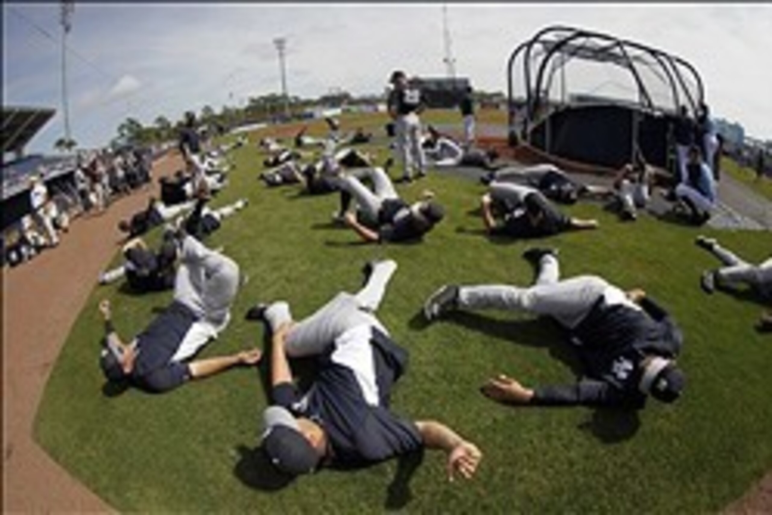 Joe Girardi (standing center) peers over his mid-March infantry; he has two weeks until he assembles a 25-man roster for Opening Day