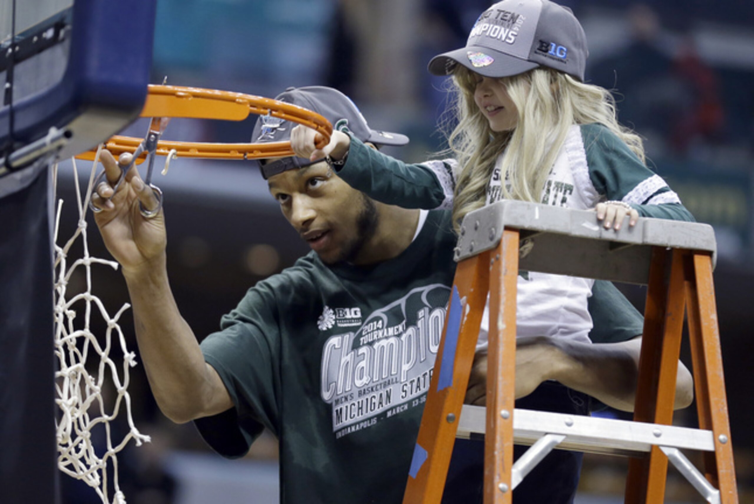 Adreian Payne and Princess Lacey cut down the net in Indy after MSU's 69-55 B1G tourney title game win over Michigan.