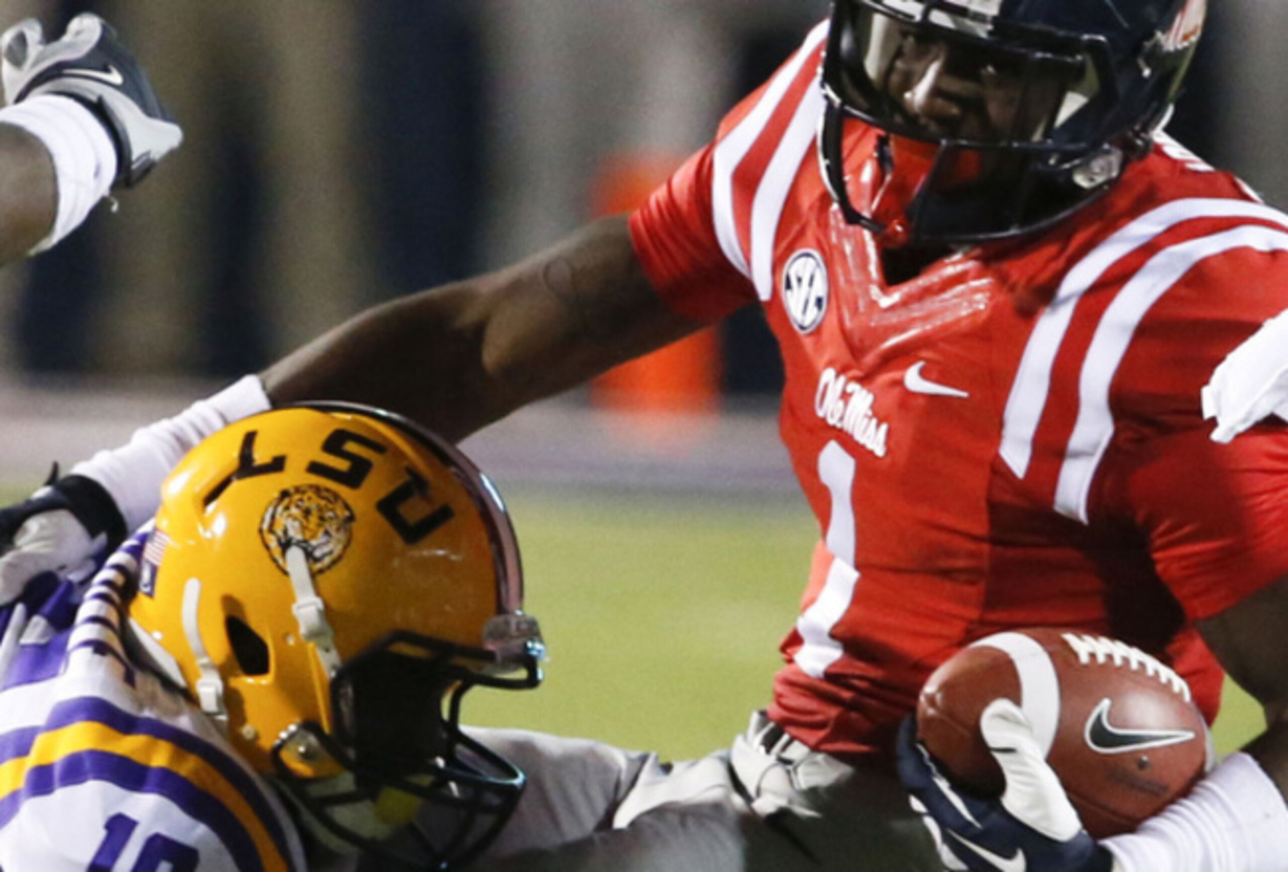 LSU cornerback Tre'Davious White tackles receiver Laquon Treadwell. The sophomores will battle against each other again this year.