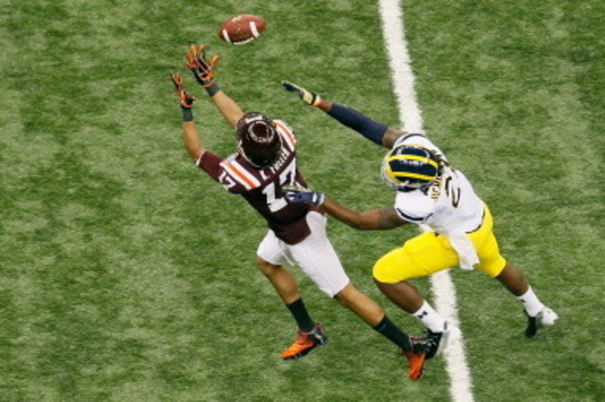 NEW ORLEANS, LA - JANUARY 03:  Kyle Fuller #17 of the Virginia Tech Hokies intercepts a pass in the first half against Junior Hemingway #21 of the Michigan Wolverines during the Allstate Sugar Bowl at Mercedes-Benz Superdome on January 3, 2012 in New Orle
