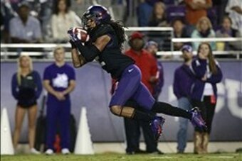 Oct 26, 2013; Fort Worth, TX, USA; TCU Horned Frogs cornerback Jason Verrett (2) intercepts a pass in the third quarter of the game against the Texas Longhorns at Amon G. Carter Stadium. Mandatory Credit: Tim Heitman-USA TODAY Sports
