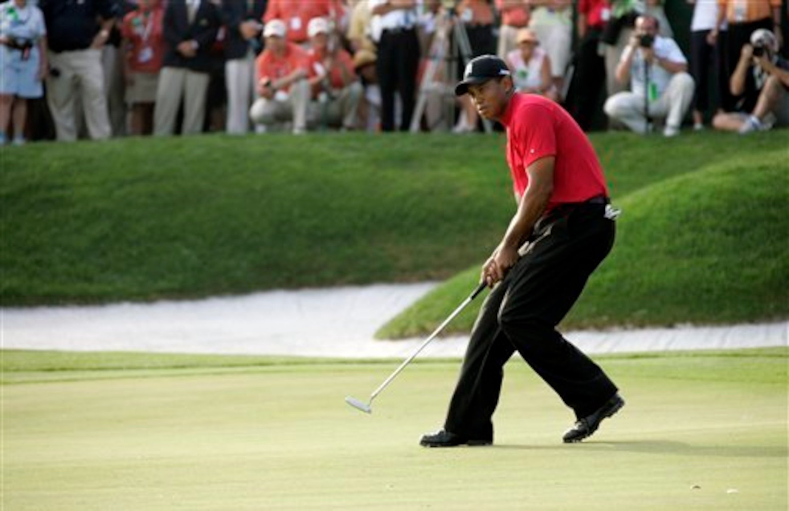 Tiger Woods followed the winning putt to the hole in 2008.
