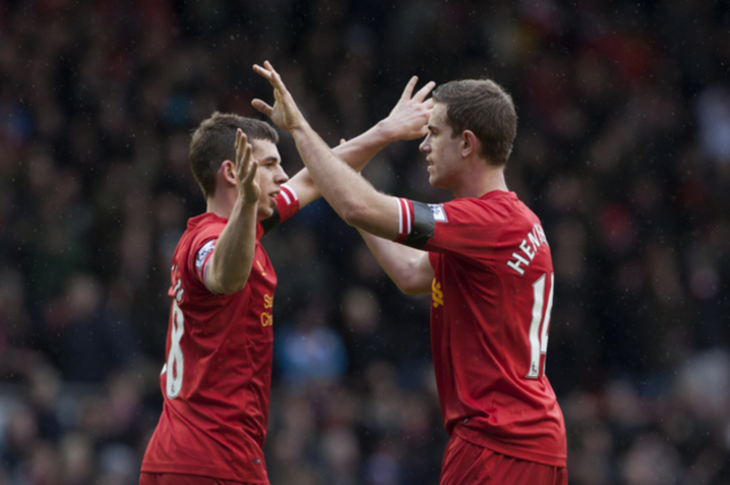 Liverpool's Jon Flanagan celebrates with team-mate Jordan Henderson.