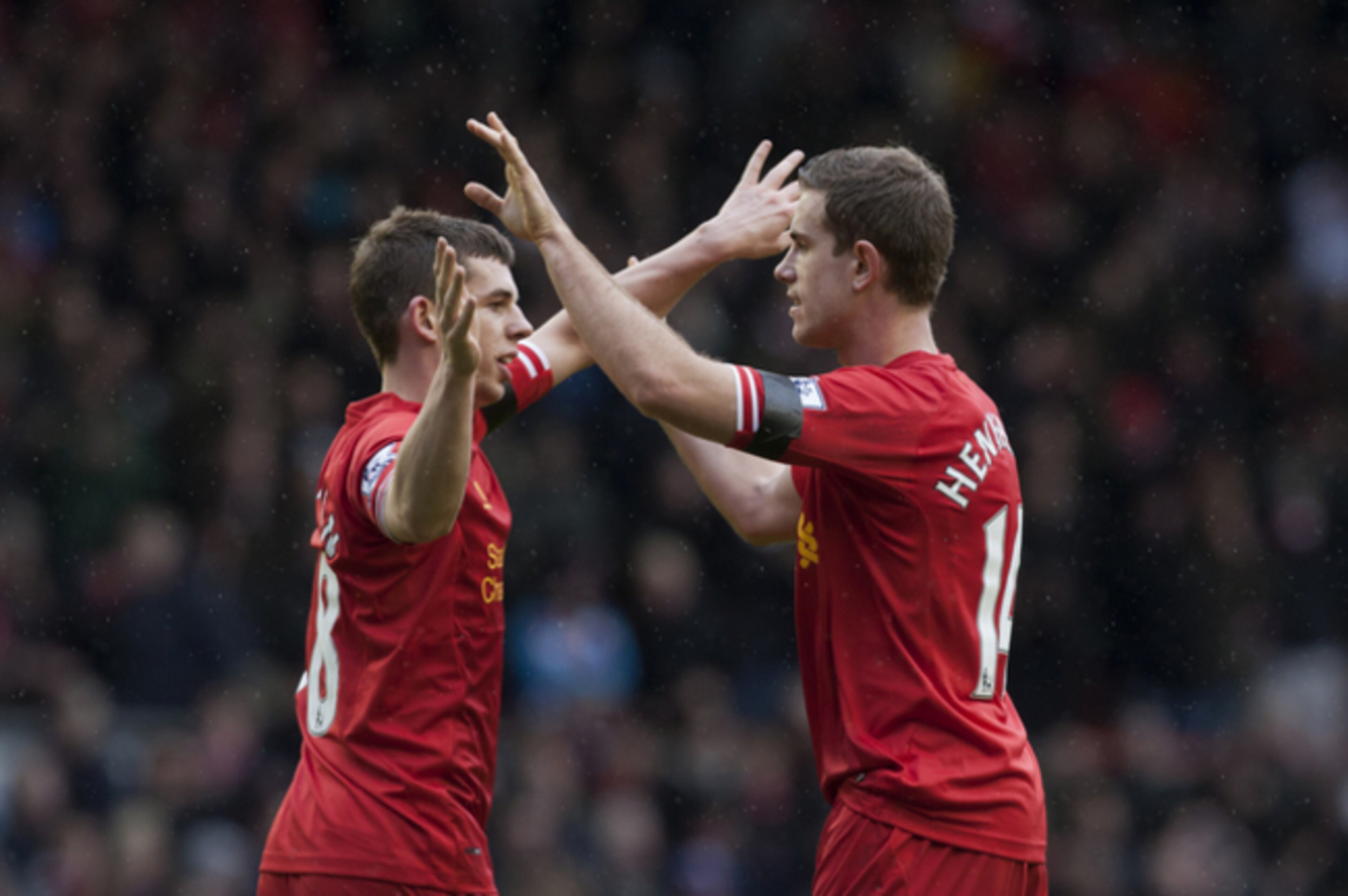 Liverpool's Jon Flanagan celebrates with team-mate Jordan Henderson.