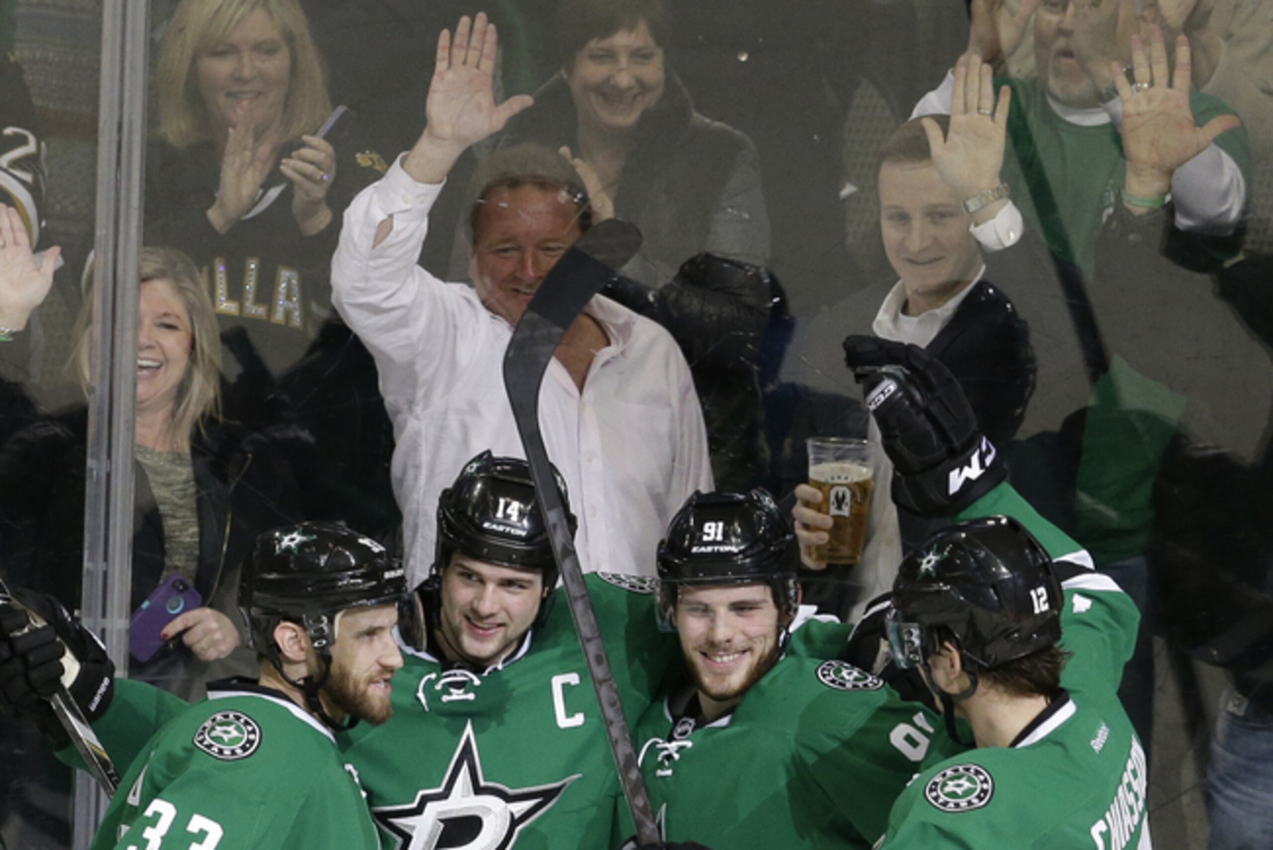 Stars (from left) Alex Goligoski, Jamie Benn, Tyler Seguin and Alex Chiasson celebrate a goal.