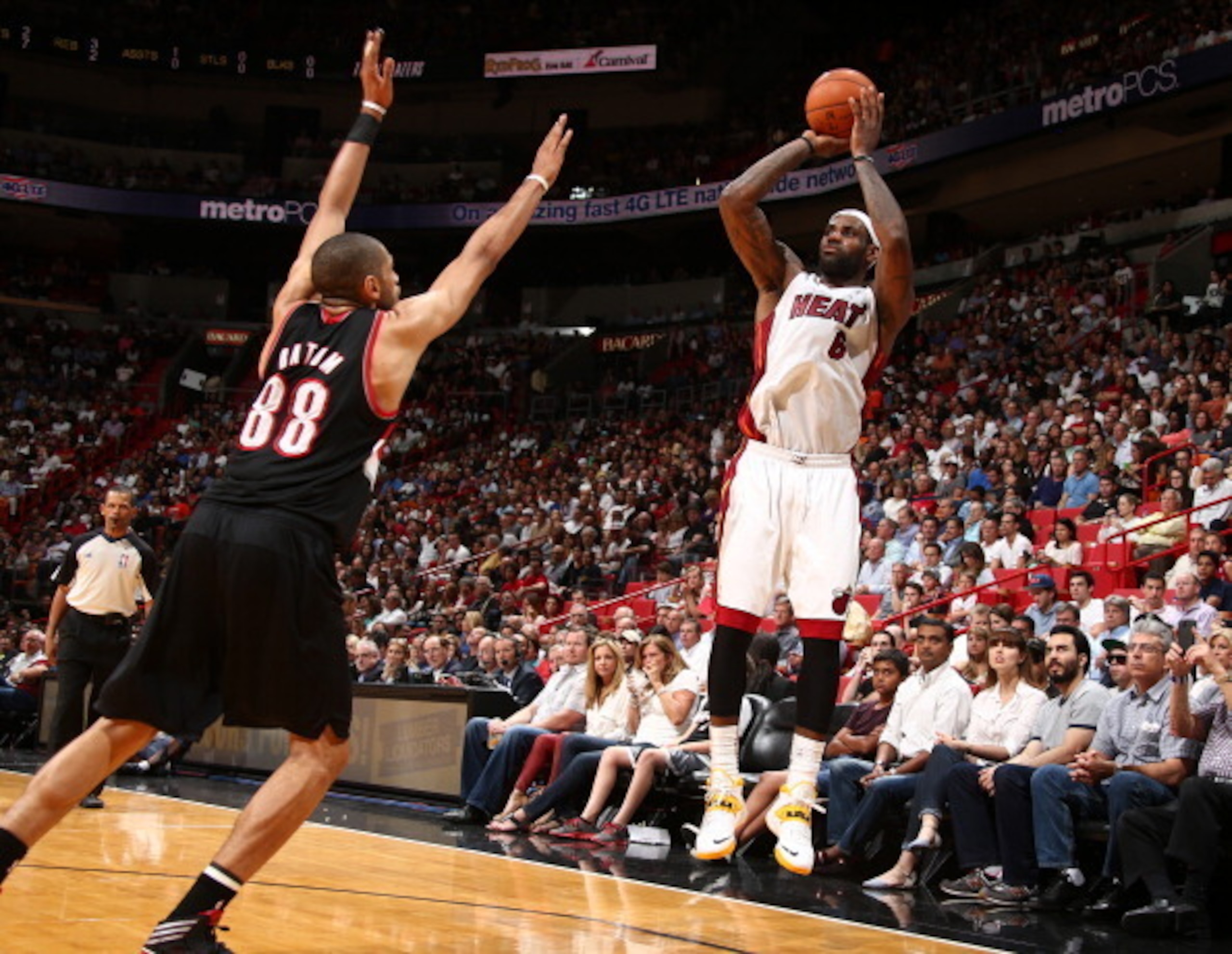 Nic Batum closes out late on LeBron James.