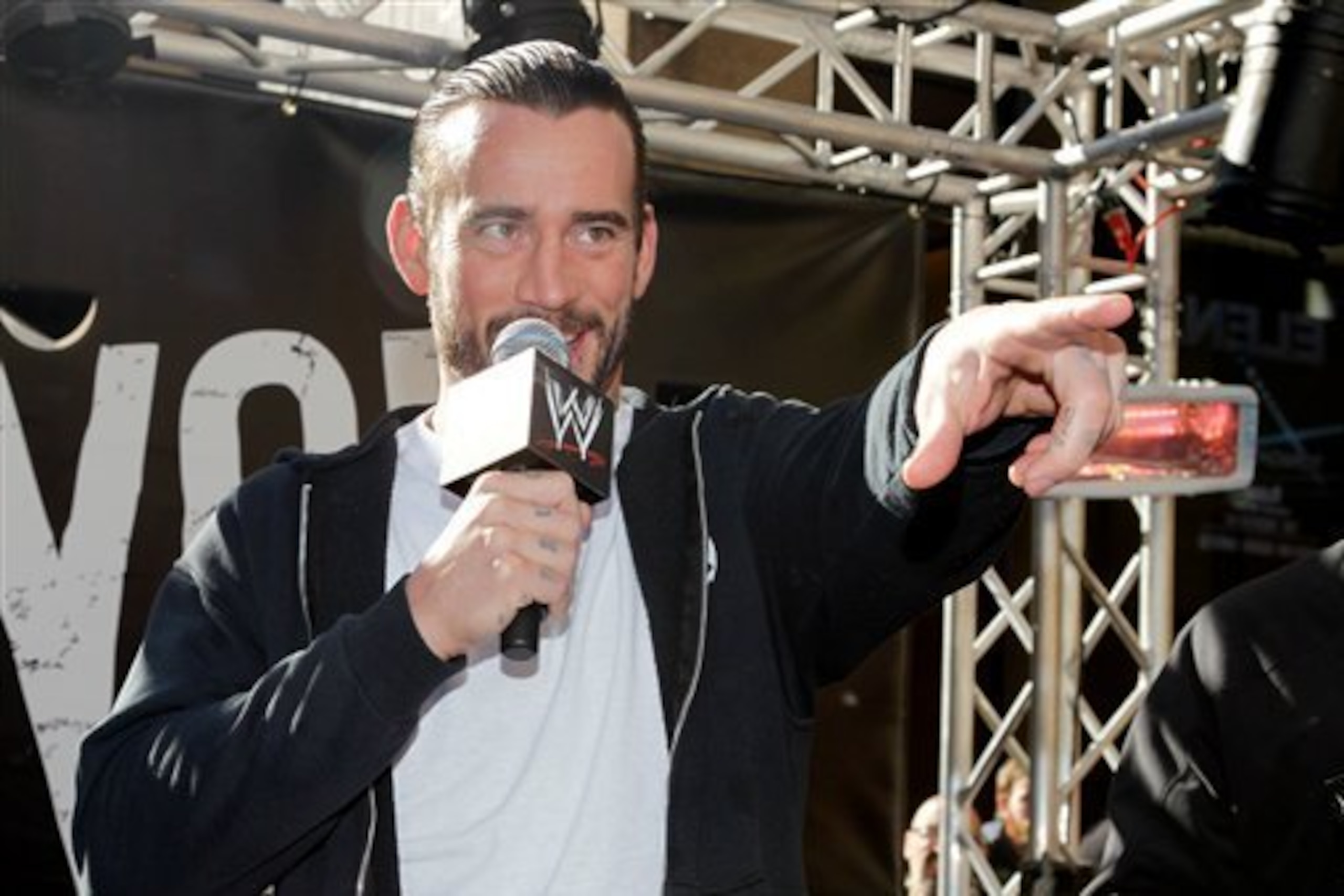 WWE Superstar CM Punk addresses the crowd at Madison Square Garden, Friday, Nov. 18, 2011, in New York, during a rally leading up to the 25th Anniversary of Survivor Series, taking place Sunday at Madison Square Garden.  The event will feature actor and w
