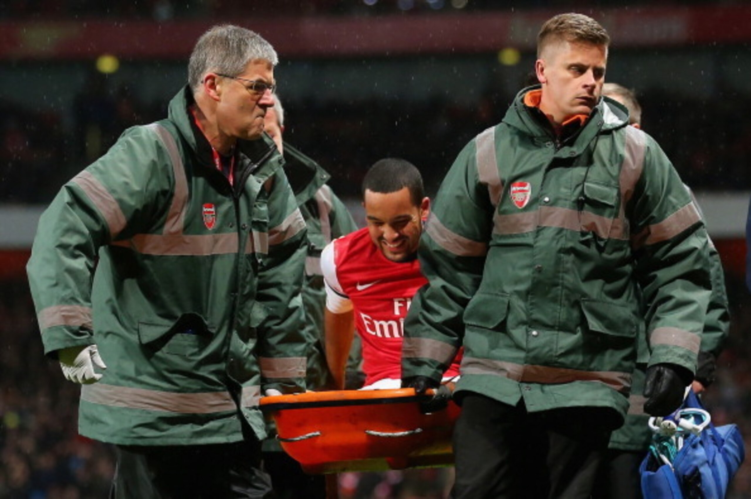 Arsenal forward Theo Walcott being carried from the field in January's 2-0 FA Cup win at home to Spurs.