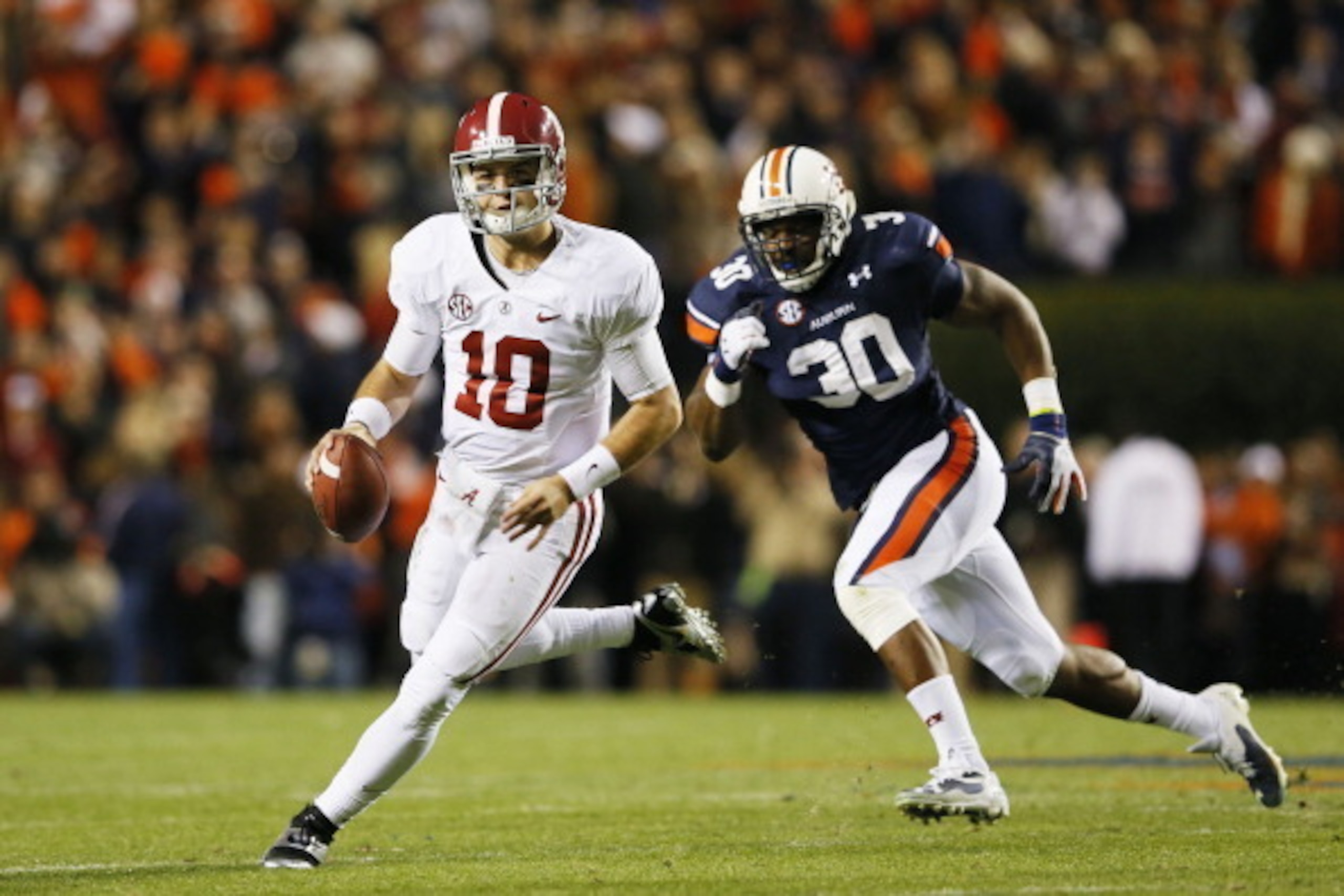 Auburn's Dee Ford (No. 30) would do much of the same for the 49ers—that is, chasing quarterbacks from behind.