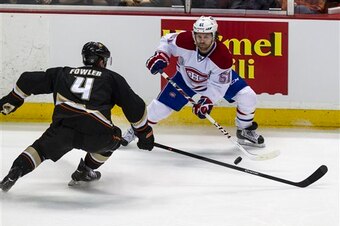 Montreal Canadiens forward David Desharnais and Anaheim Ducks defenseman Cam Fowler.