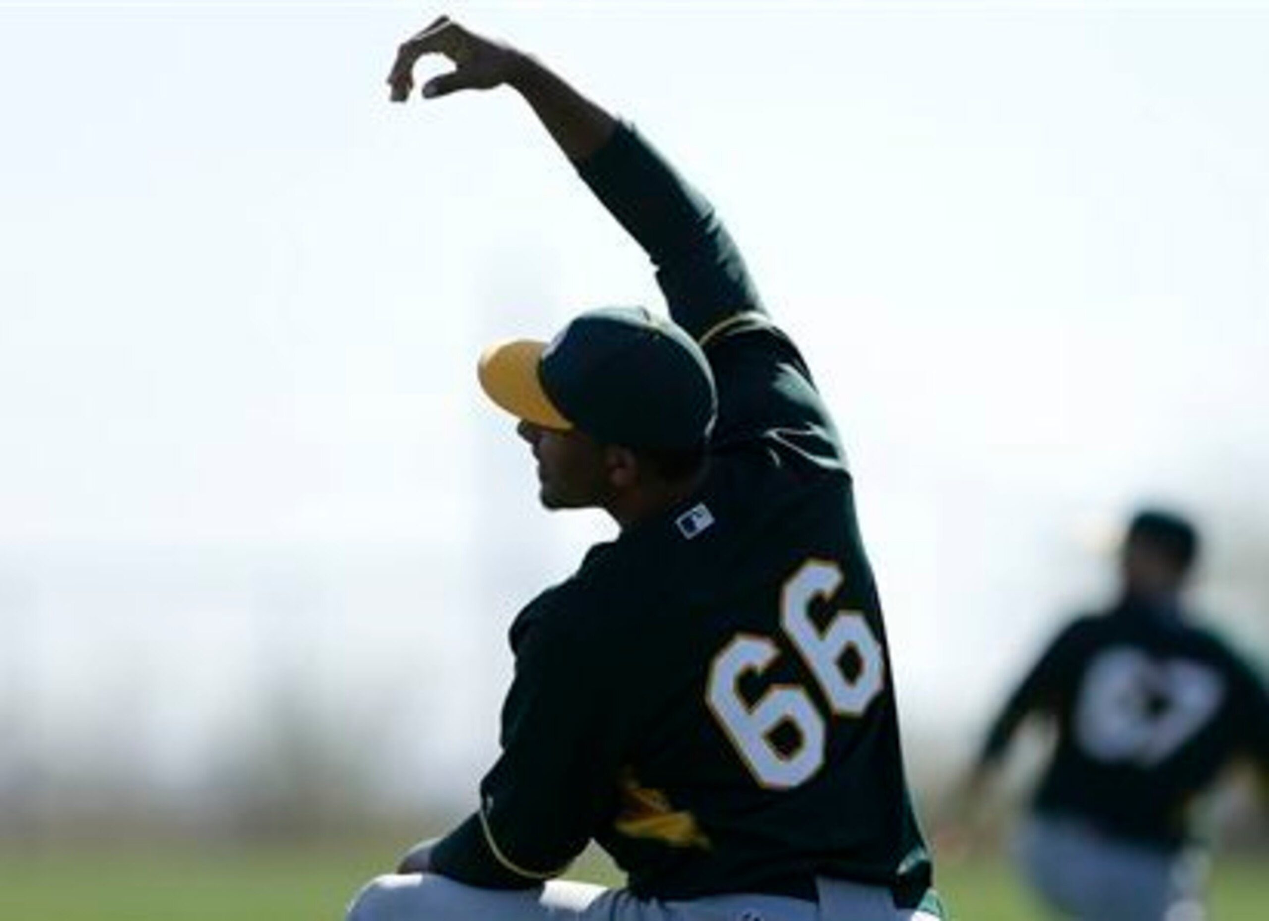 Michael Ynoa stretches while with the A's in spring training. Michael Ynoa stretches while with the A's in spring training.