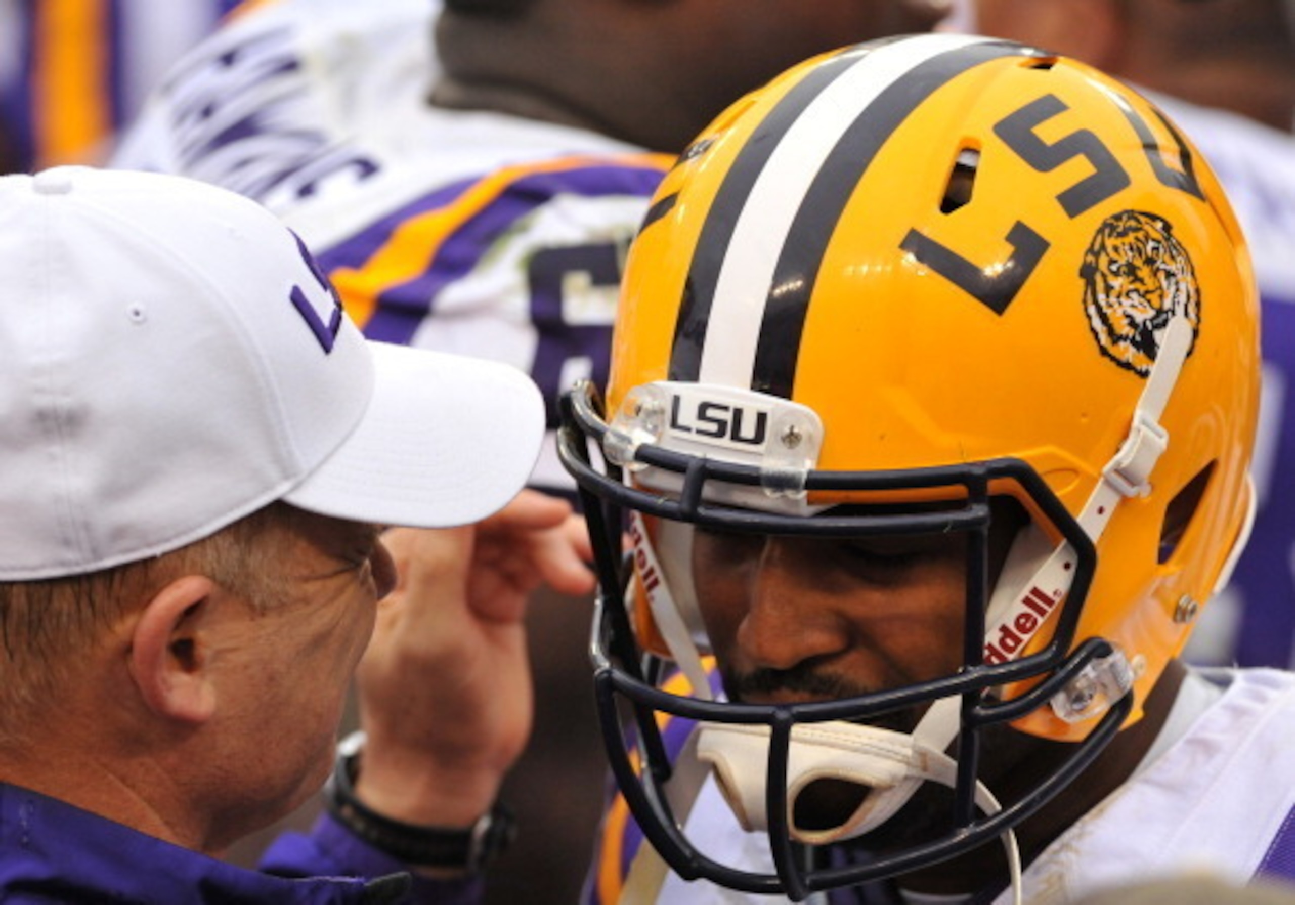 Les Miles embraces LSU quarterback Anthony Jennings before the Outback Bowl against Iowa.