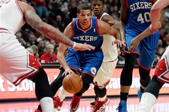 Carter-Williams weaving through the defense.