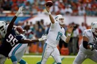Ryan Tannehill (17, above) earned his first victory against the Patriots in 2013.