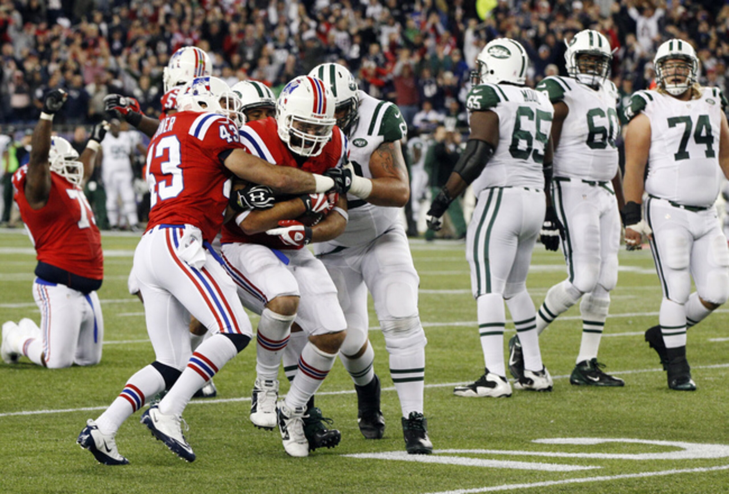 No. 74 Nick Mangold with No. 60 D'Brickashaw Ferguson and No. 65 Brandon Moore during the first Patriots' game of 2012.