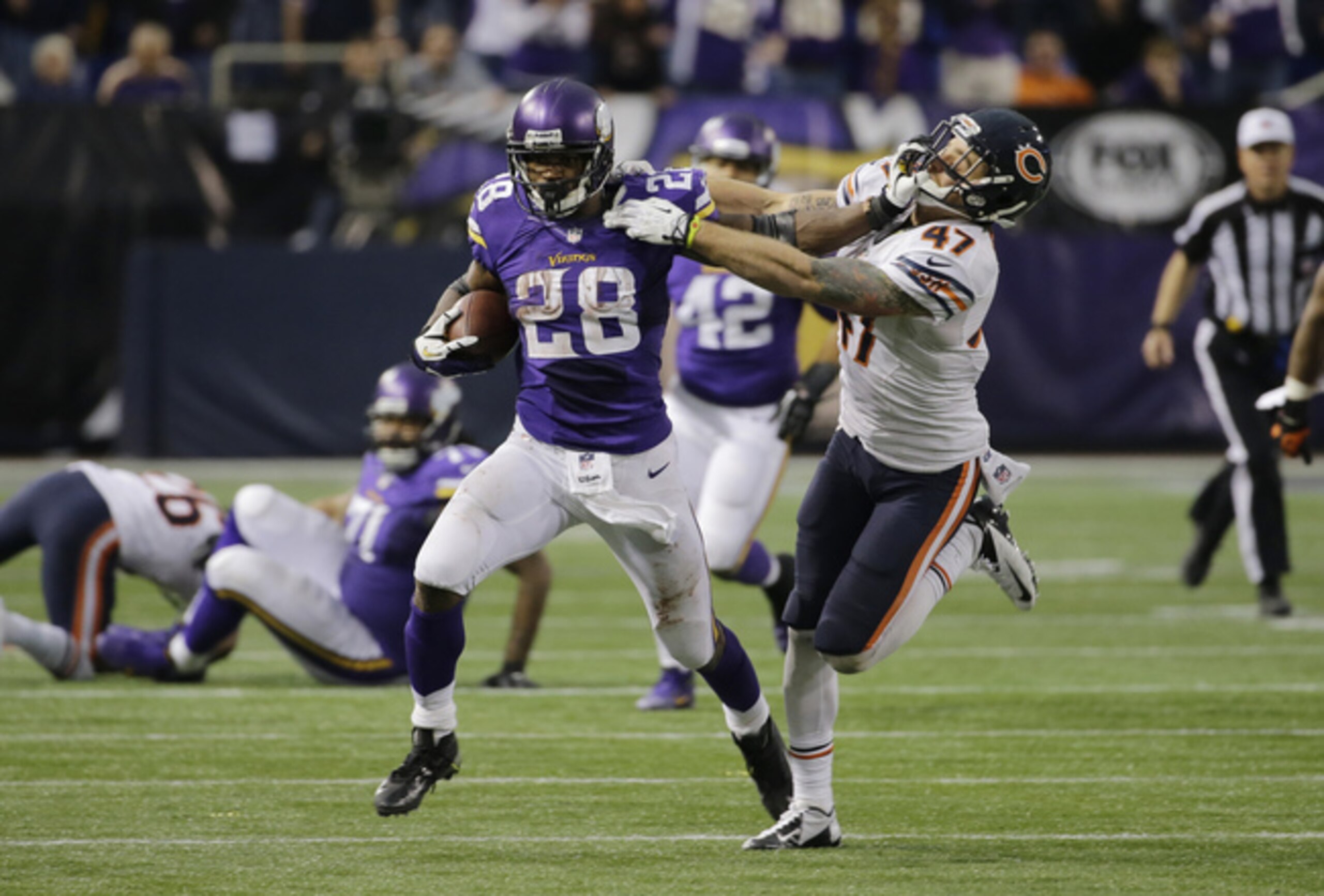 Vikings RB Adrian Peterson (28) is tough to tackle.
