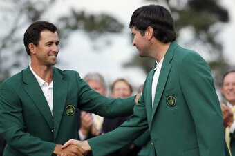 The passing of the green jacket from Adam Scott to Bubba Watson.