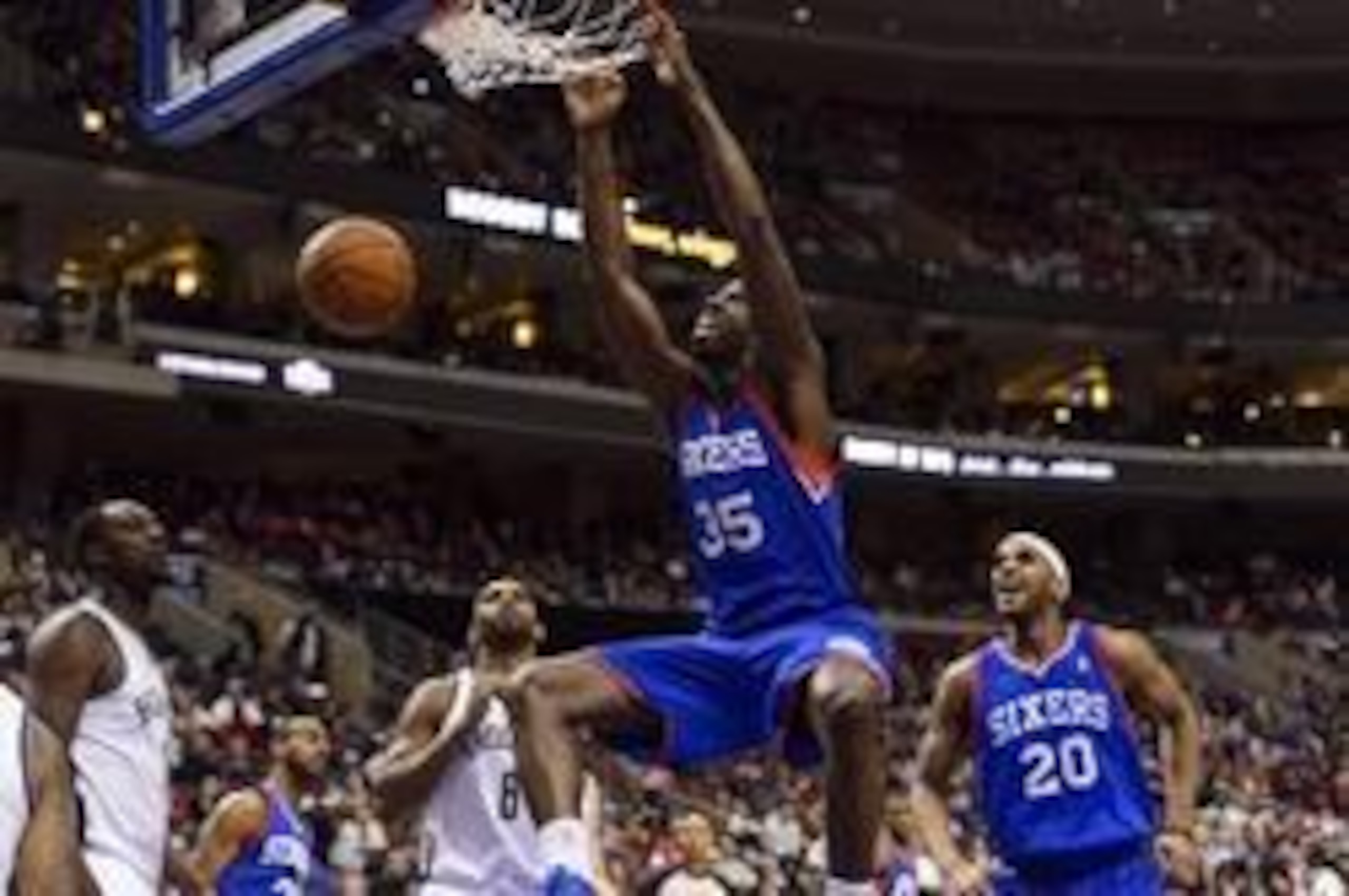 Henry Sims slams it down as Brandon Davies marvels.