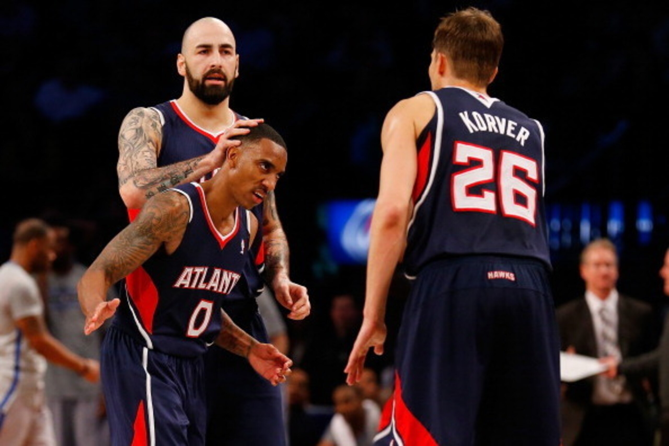 Atlanta Hawks center Pero Antic and guard Kyle Korver celebrate with guard Jeff Teague.