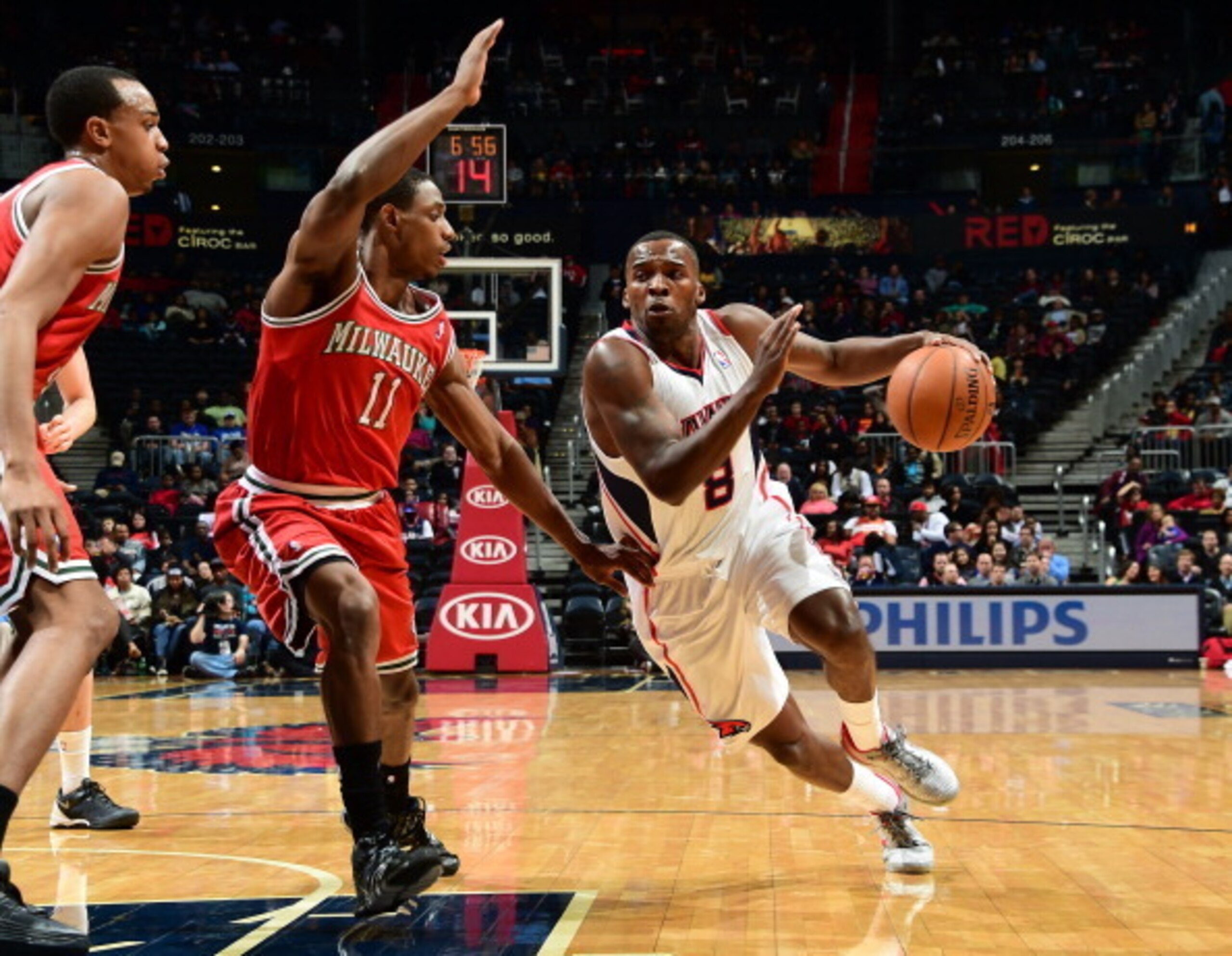 Shelvin Mack drives against Milwaukee Bucks guard Brandon Knight.