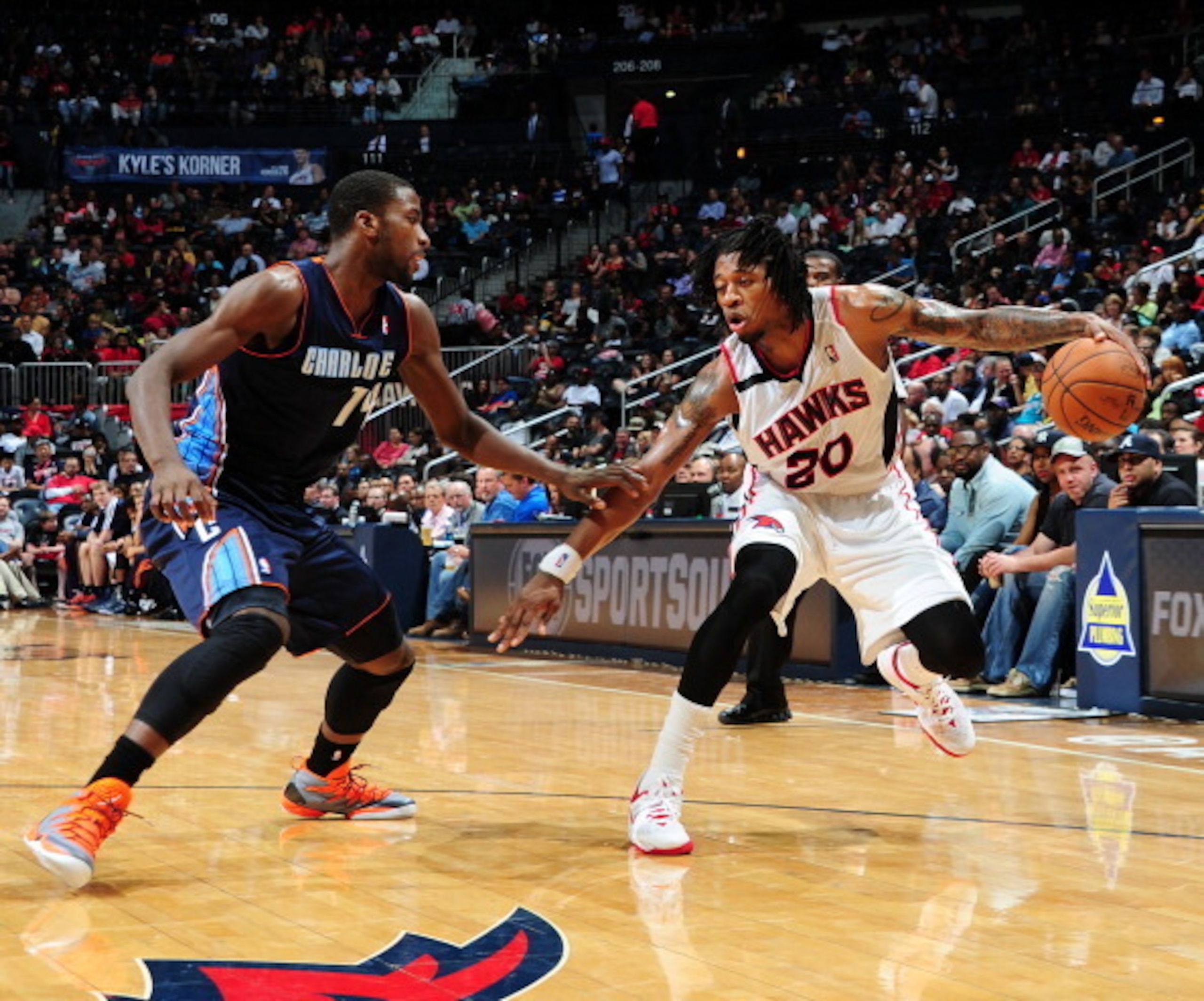 Cartier Martin makes a move against Charlotte Bobcats forward Michael Kidd-Gilchrist