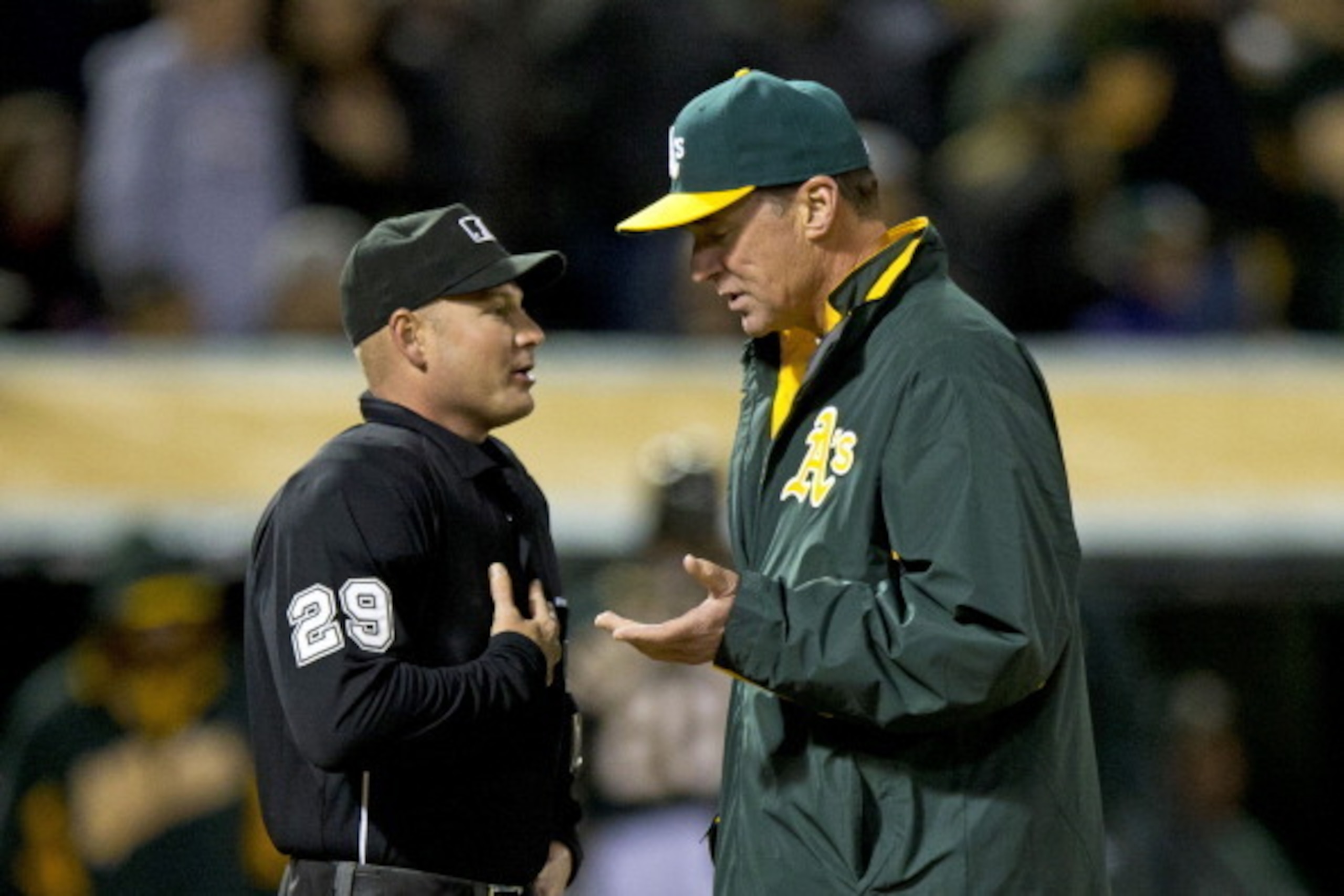 Is Bob Melvin discussing the plumbing, rain or instant replay?