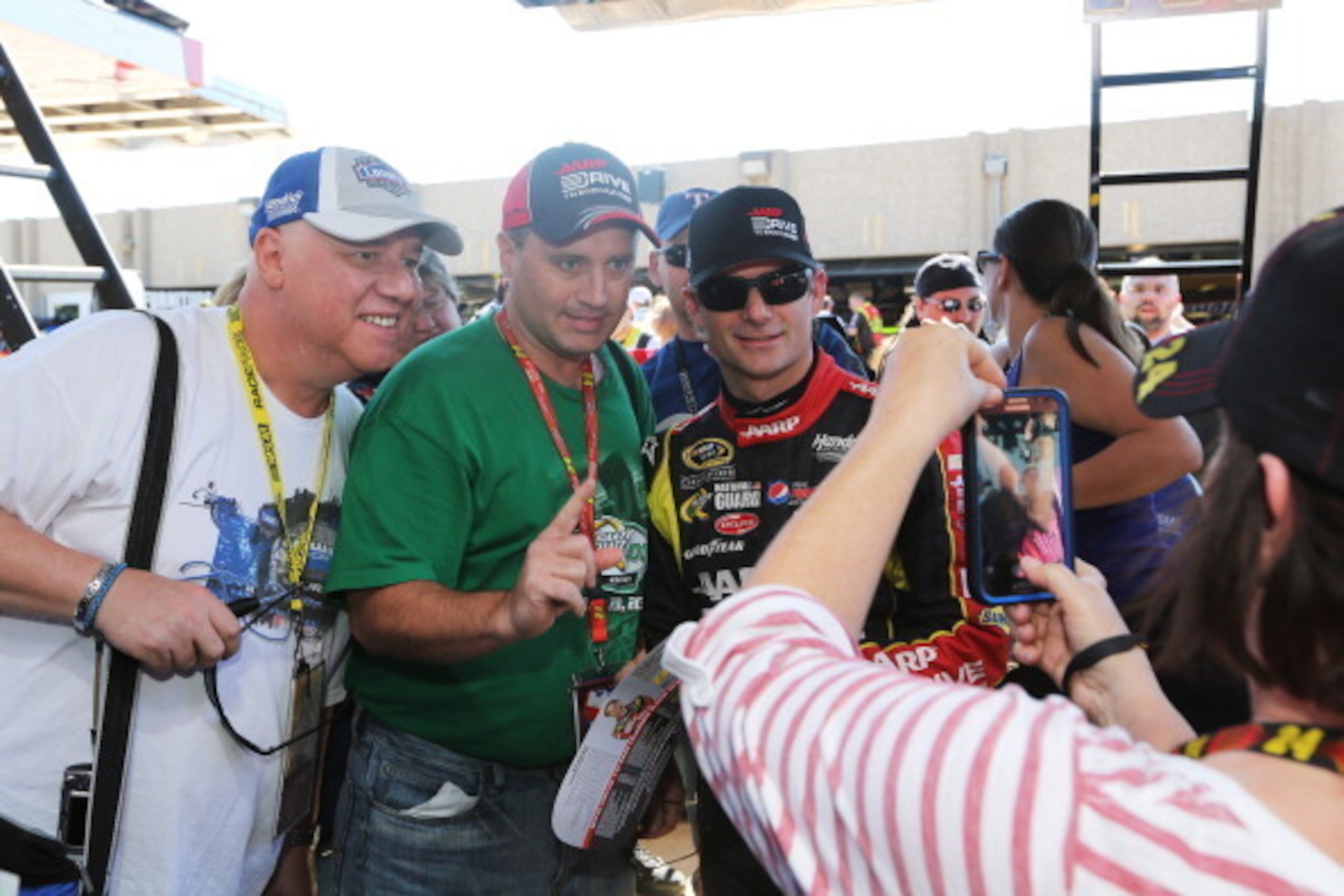 Jeff Gordon posing with fans at Texas in 2014
