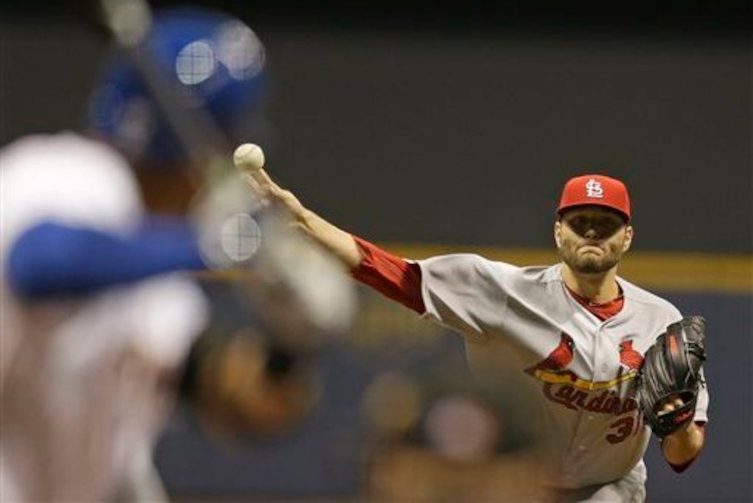 Lance Lynn throws a pitch against the Brewers on April 14.
