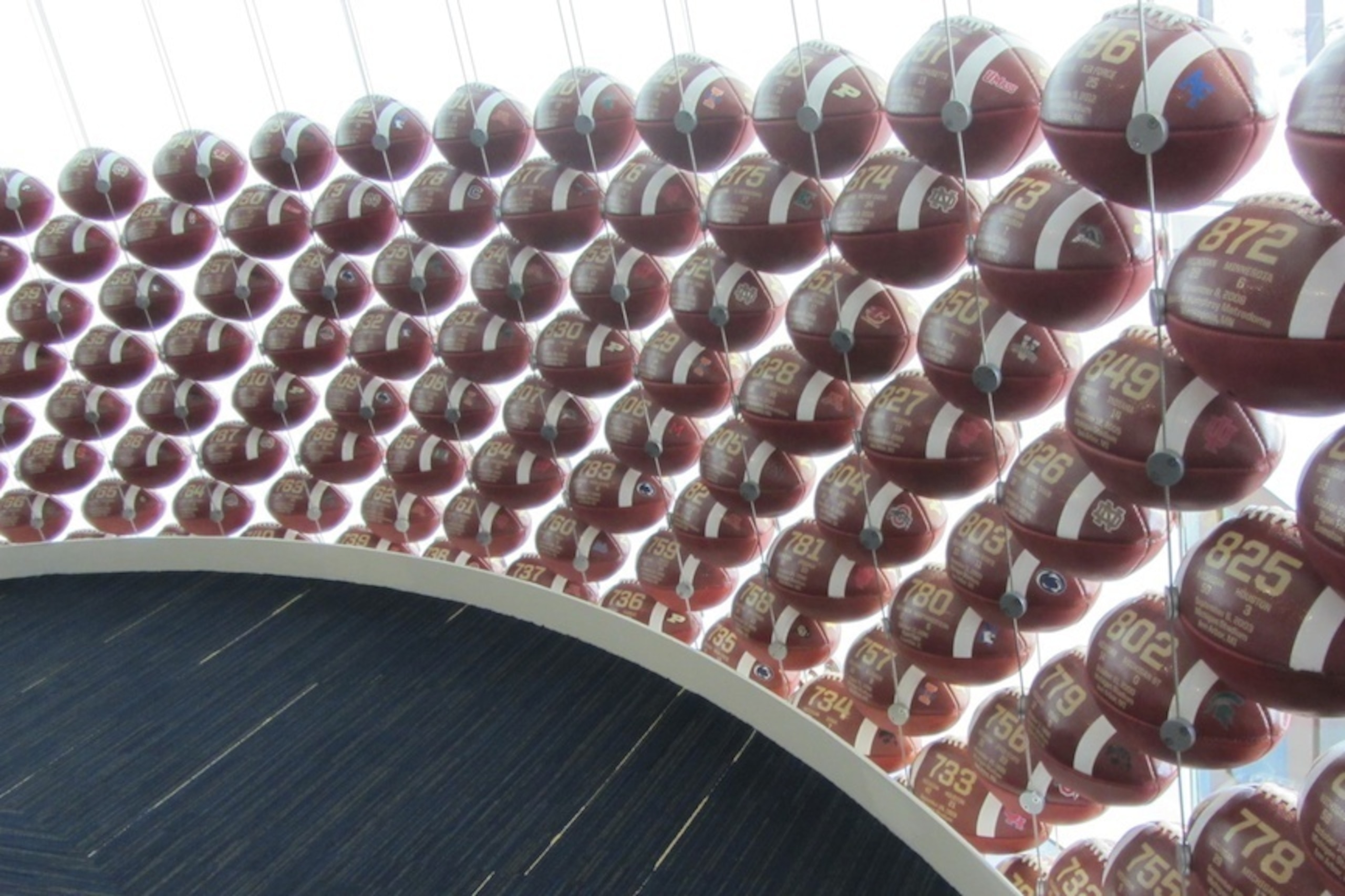 There is a two-story football display representing every victory in the program's history.