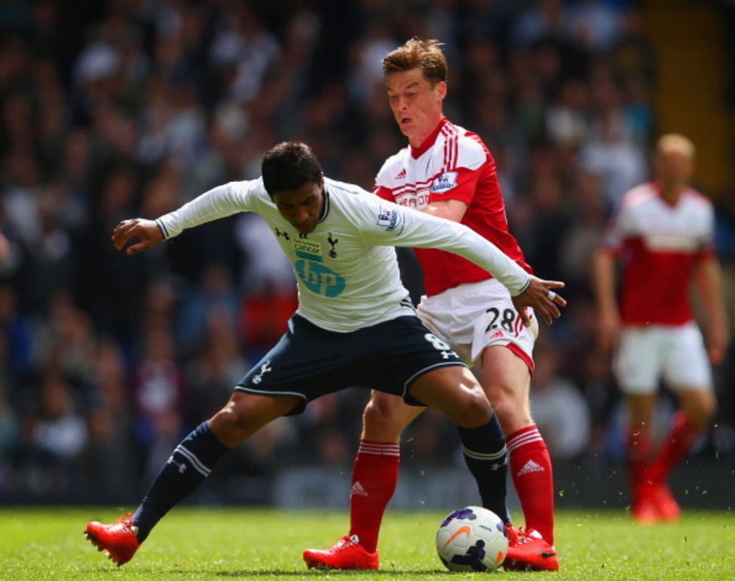 Scott Parker battles it out with Paulinho. Scott Parker battles it out with Paulinho.