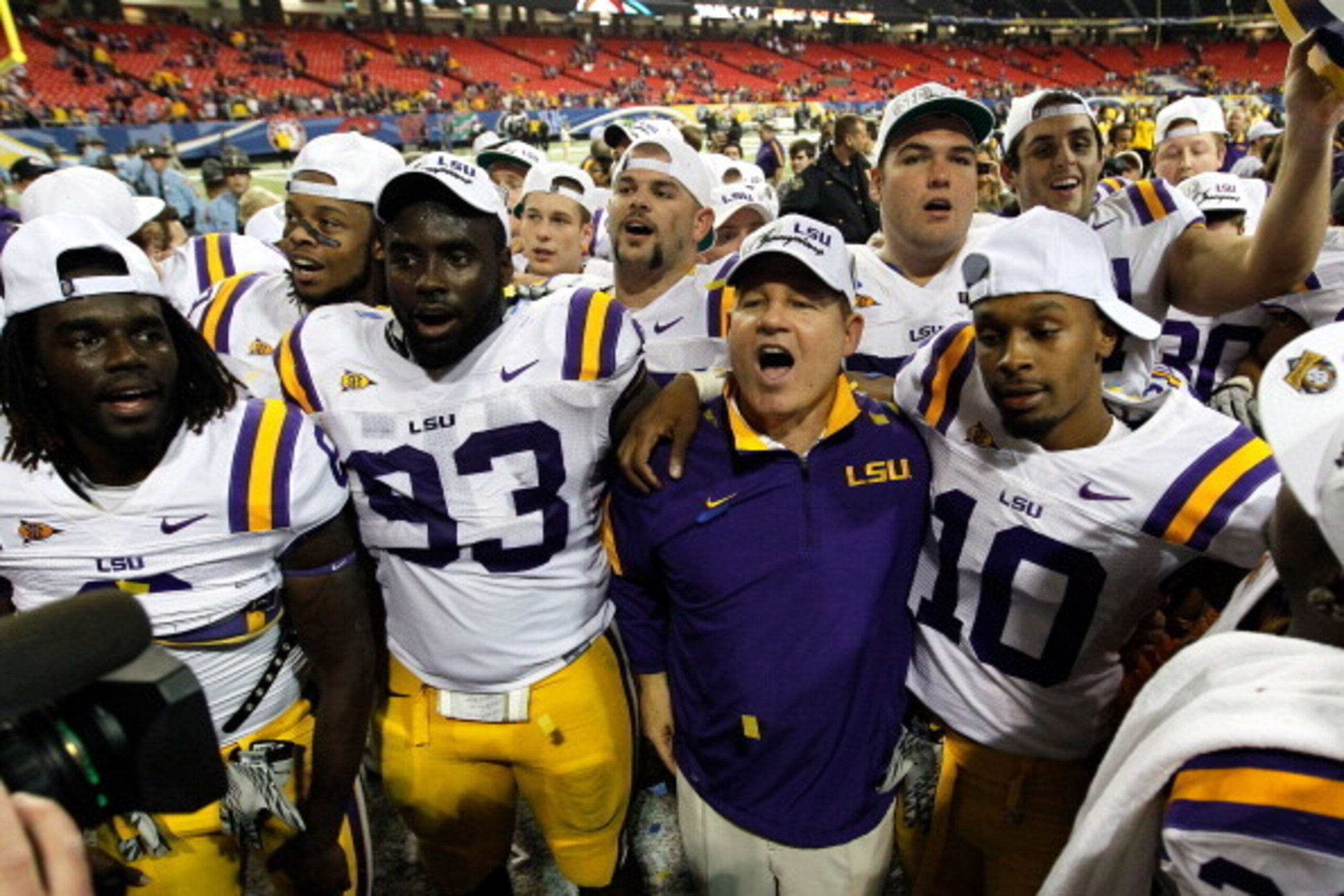 Les Miles celebrates with his Tigers after winning the SEC Championship Game against Georgia in 2011.