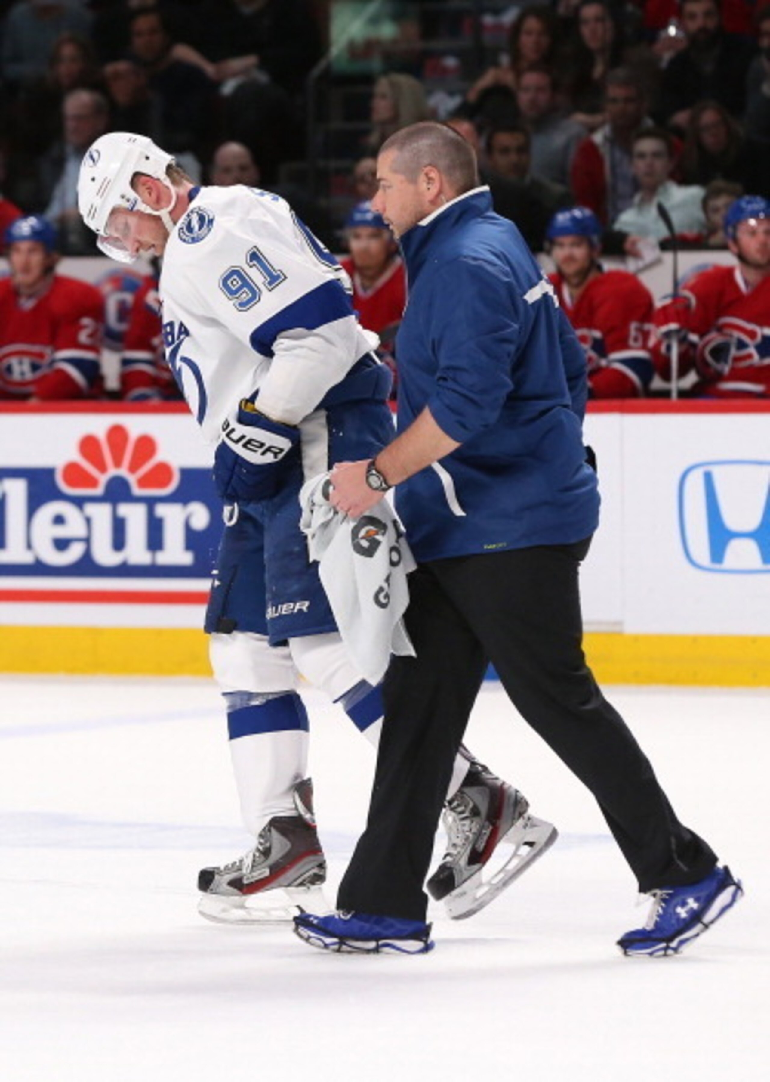 Steven Stamkos gets helped off the ice.