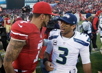 Quarterbacks Colin Kaepernick (left) and Russell Wilson (right) will have to wait until Week 13 to square off in 2014.