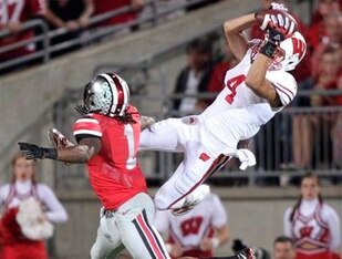 Wisconsin WR Jared Abbrederis (right) carved up Ohio State CB Bradley Roby (left), considered a first-round prospect, for 10 catches, 207 yards and a touchdown.