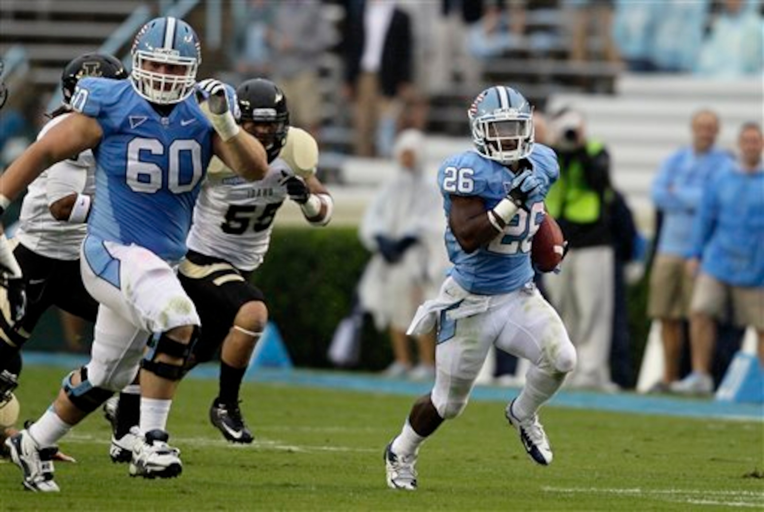 UNC offensive lineman Russell Bodine (left) can get out in front of a play as a lead blocker.