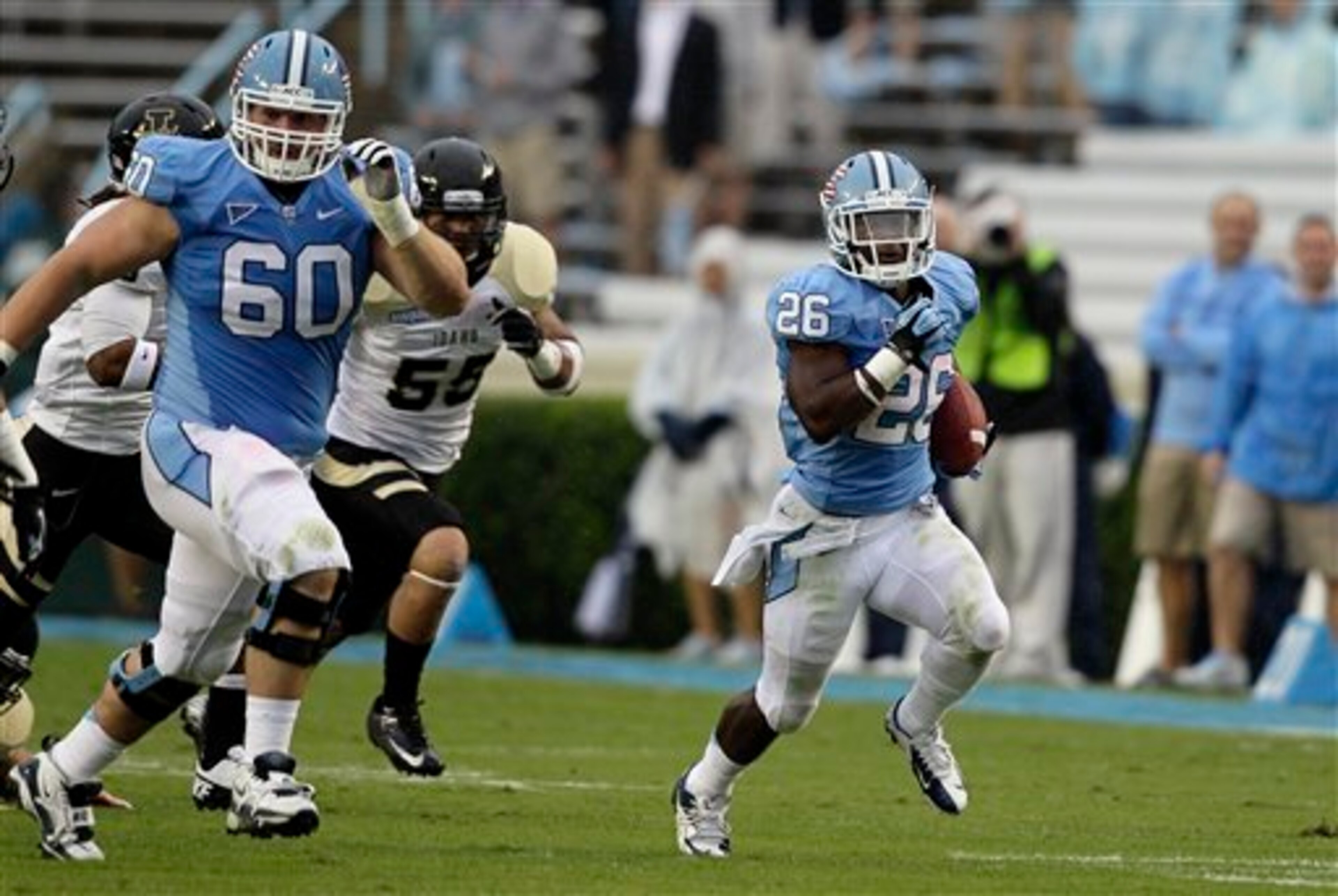 UNC offensive lineman Russell Bodine (left) can get out in front of a play as a lead blocker. UNC offensive lineman Russell Bodine (left) can get out in front of a play as a lead blocker.