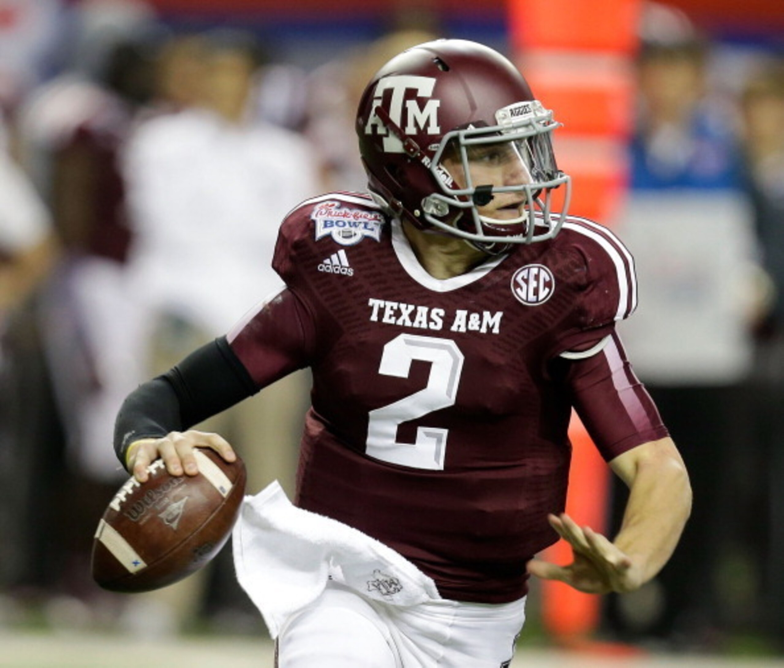 ATLANTA, GA - DECEMBER 31:  Quarterback Johnny Manziel #2 of the Texas A&M Aggies rolls out and looks downfield to pass during the the Chick-fil-A Bowl game against the Duke Blue Devils at the Georgia Dome on December 31, 2013 in Atlanta, Georgia.  (Photo
