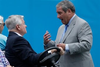 Owner Jerry Richardson (left) and GM Dave Gettleman converse before a game.