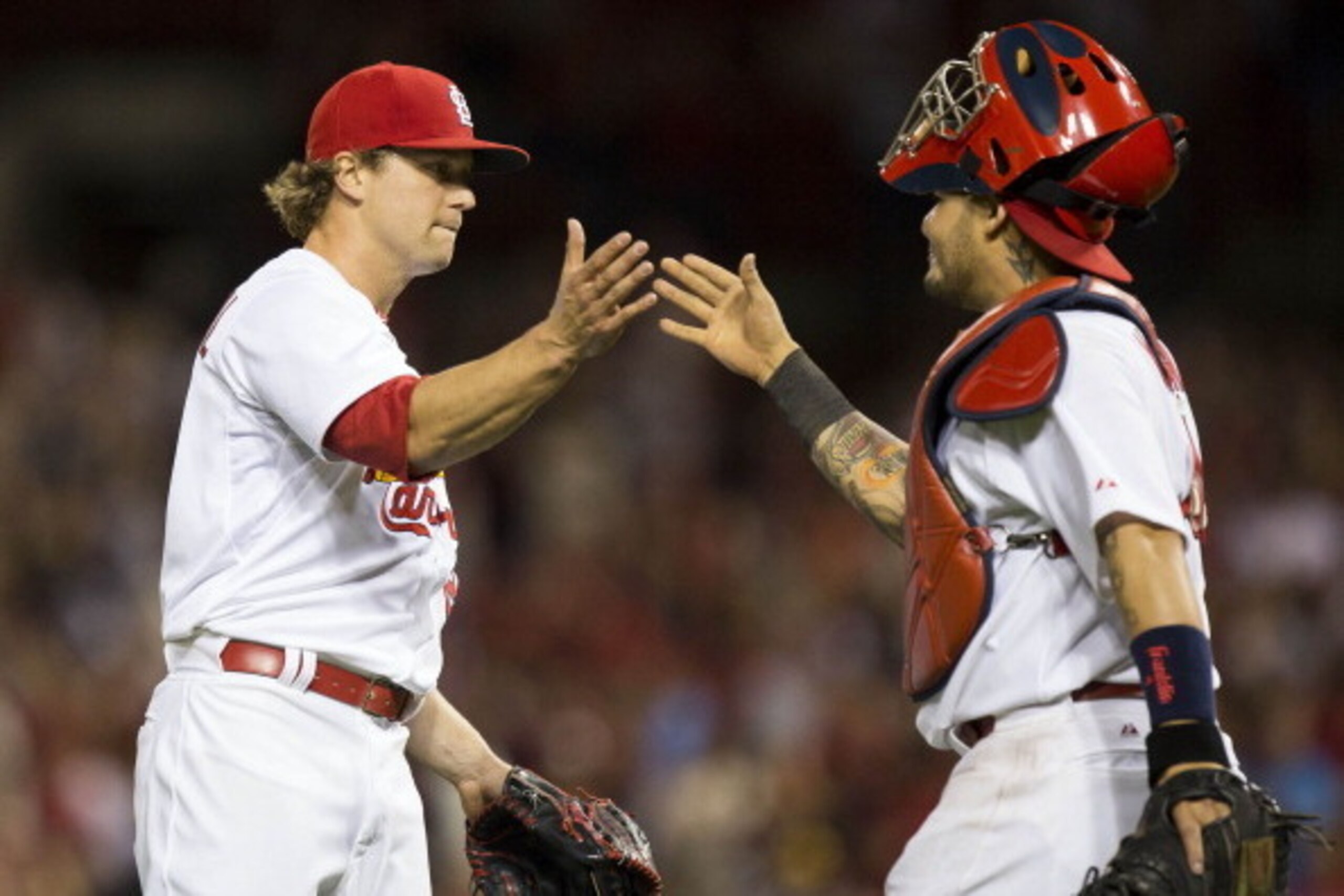 Trevor Rosenthal and Yadier Molina celebrate after defeating the Pirates on April 25.