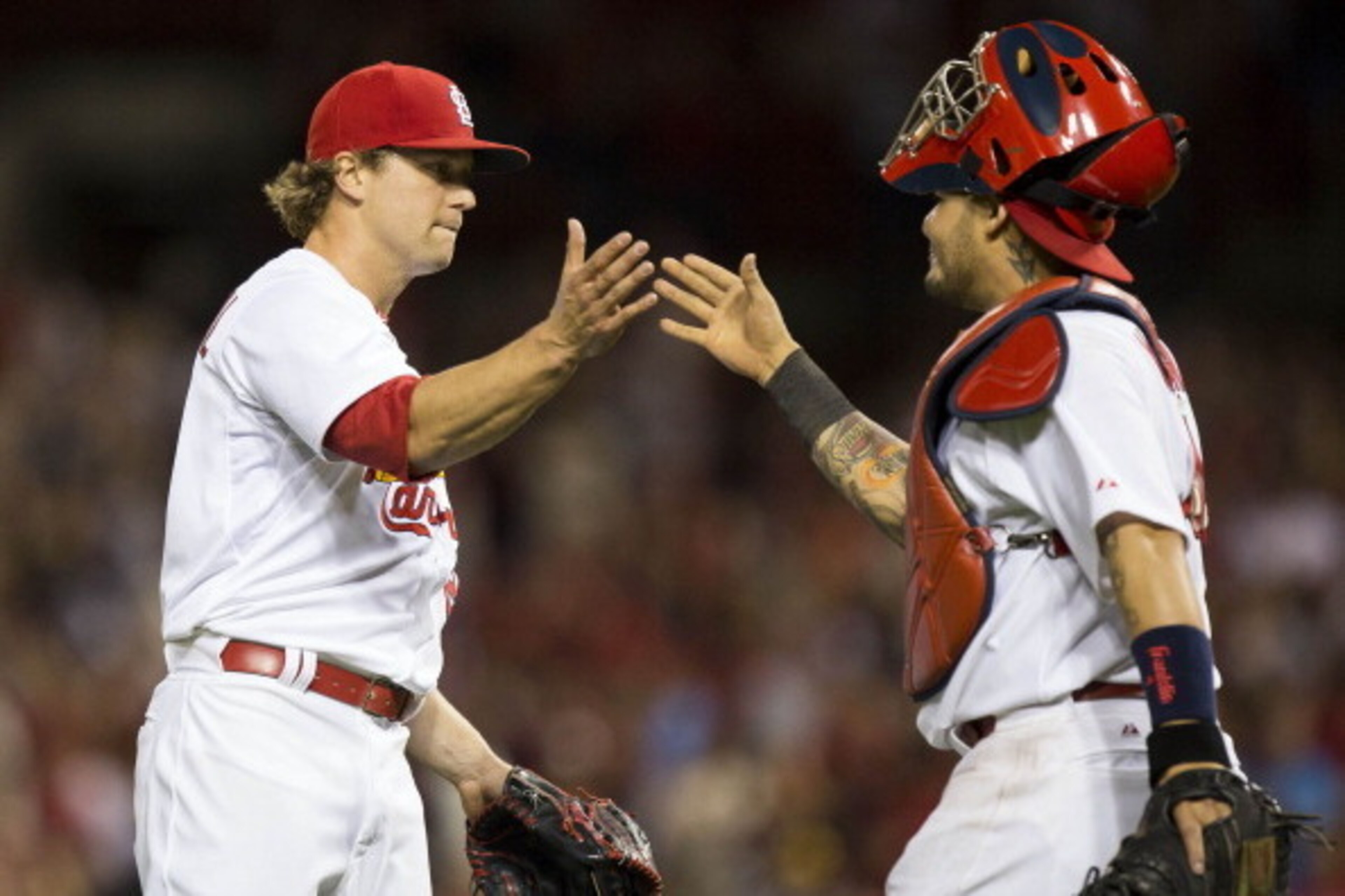 Trevor Rosenthal and Yadier Molina celebrate after defeating the Pirates on April 25.