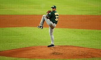 SYDNEY, AUSTRALIA - MARCH 21:  Tim Atherton of Australia pitches during the match between Team Australia and the Arizona Diamondbacks at Sydney Cricket Ground on March 21, 2014 in Sydney, Australia.  (Photo by Mark Nolan/Getty Images)