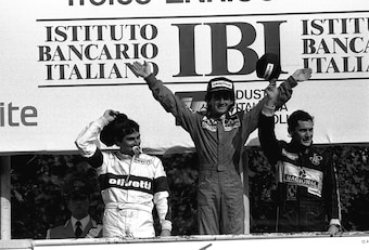Piquet (left) and Senna (right) on the podium at the 1985 Italian GP with Alain Prost.