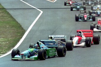 Schumacher passes Senna into the first corner of the 1994 Pacific Grand Prix.